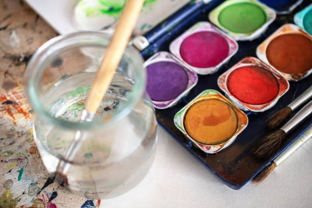 istock painting lessons, canvas with paints, brushes and other elements for painting 1992349501