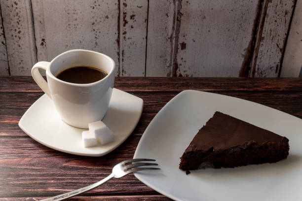 istock Chocolate cake on a plate and coffee 1992354374
