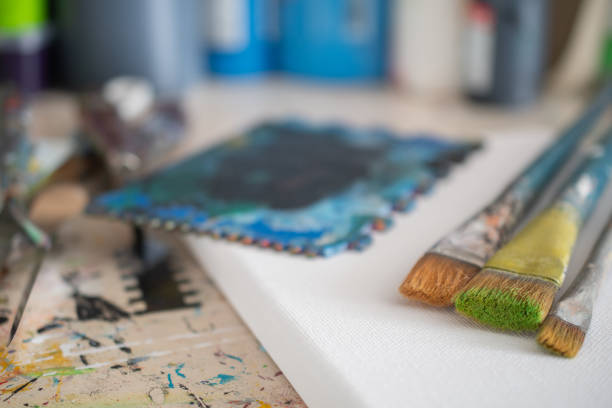 painting lessons, canvas with paints, brushes and other elements for painting