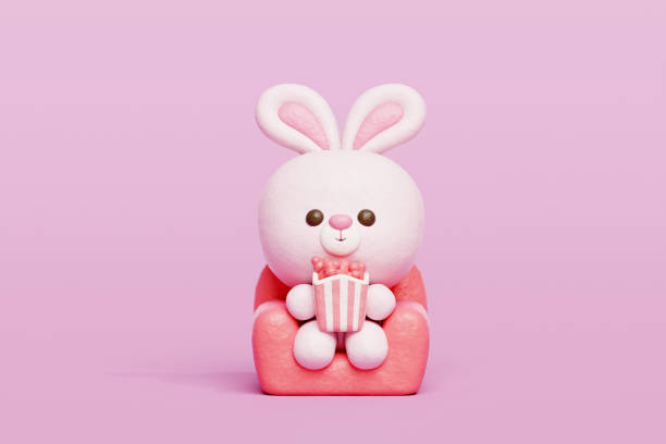 istock 3D cute rabbit watching a movie, Cartoon animal character, 3D rendering. 1992377116