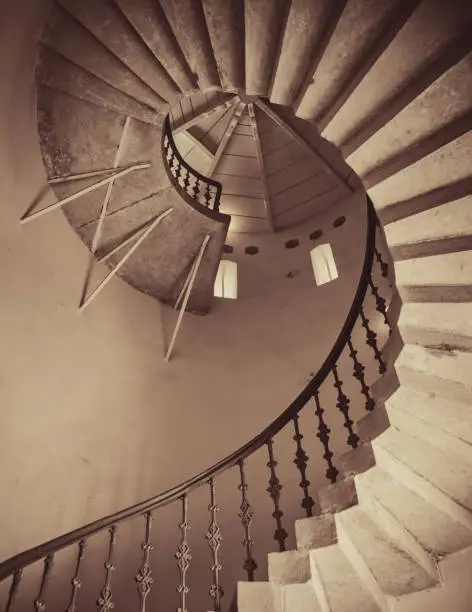 Photo of Sepia toned image of spiral staircase