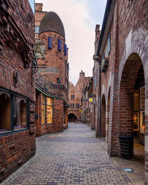 Bremen, Germany – June 06, 2022: A charming urban alley with various architectural structures in Bremen, Germany.