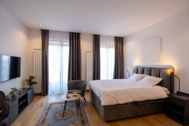 istock Interior of a bedroom with wall mouted tv 1992408697