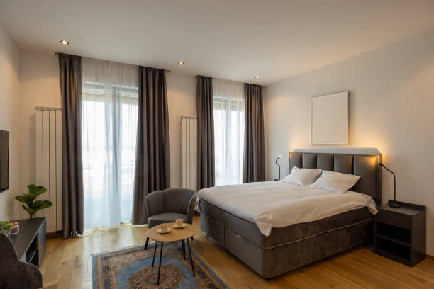 istock Interior of a bedroom with large master bed 1992409262