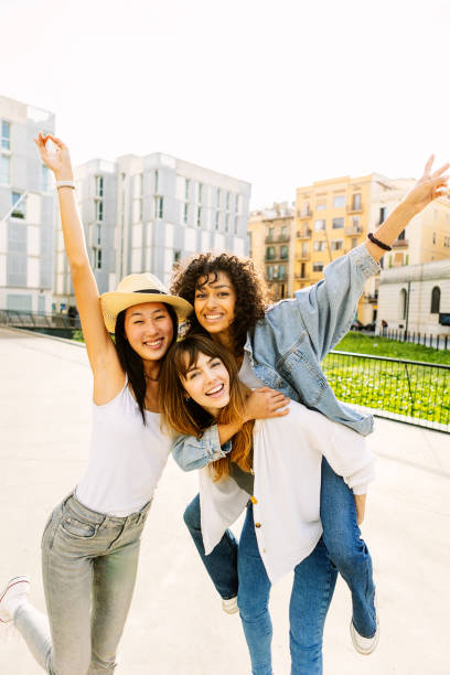 istock Young group of three multiracial women having fun enjoying summer vacation 1992424977