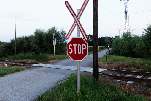 Stop warning sign in railroad crossing