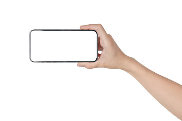 istock Hand holding smartphone with blank screen isolated on white background. 1992450386