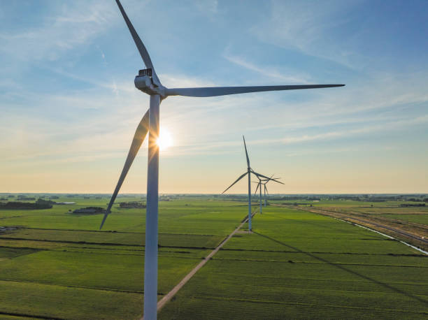 istock Wind turbines in a rural landscape during springtime sunset seen from above 1992450405