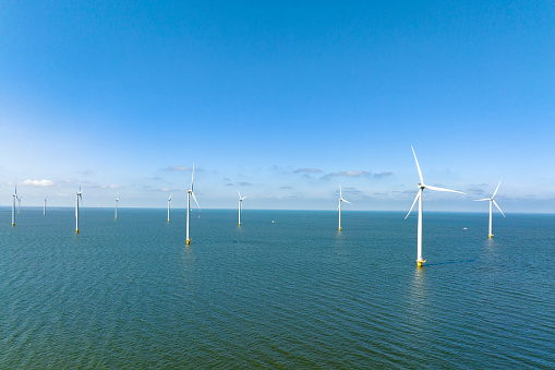 Wind turbines in the Noordoostpolder in Flevoland, The Netherlands, during springtime seen from above.
