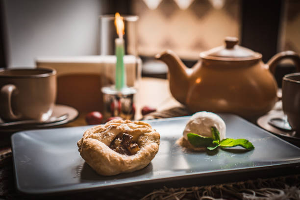 Arabic Cuisine; Traditional Middle Eastern Cheese Kunafa Dessert. A delicious pastry consisting of soft melty cheese and shredded phyllo dough. Served with sugar syrup and crushed pistachio.