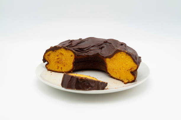 istock Carrot cake with chocolate icing. Brazilian cake. Isolated on white background 1992539338