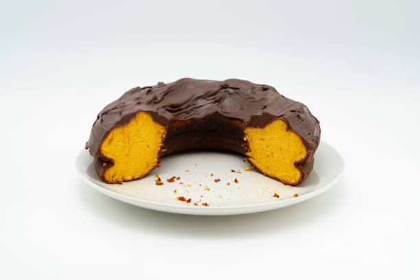 istock Carrot cake with chocolate icing. Brazilian cake. Isolated on white background 1992539351