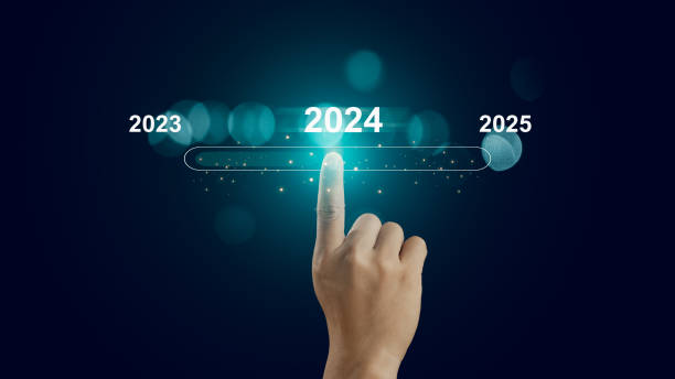 istock Human hand touch on virtual bar status to change from 2023 to 2024 and 2025 for preparation and focus new business concept, establish goals and a business plan, start new business and new life 1992543695