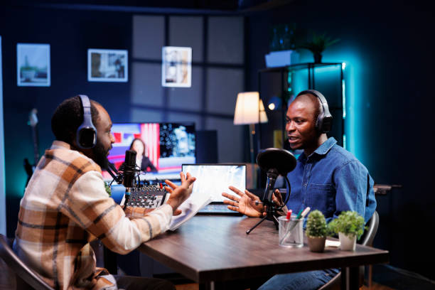 istock Black men recording a talk show at home 1992561307