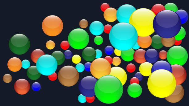 istock A bunch of colorful crystal balls. Scattered Glass spheres on dark background. 1992567847
