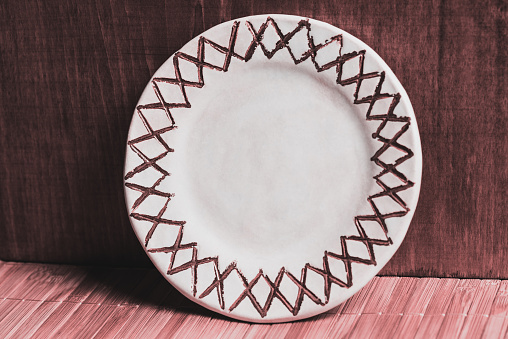 Clay plate made by hand. Handmade. Drive for food.