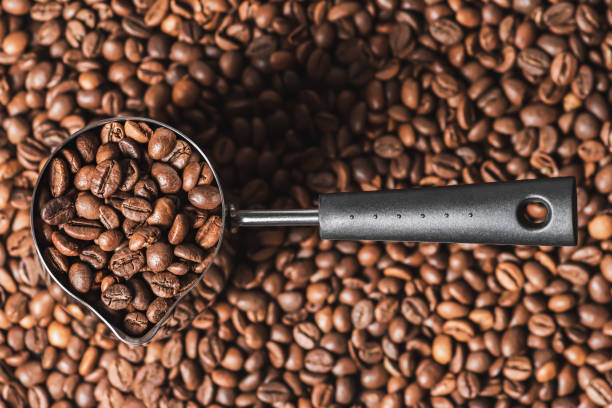 istock Coffee grains in the Turk. Grain for brewing. Morning with fresh coffee. Making coffee. 1992579495