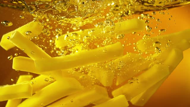 Super Slow Motion of Falling French Fries into Oil.