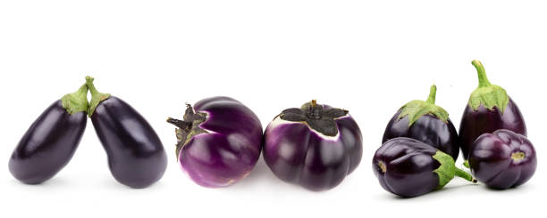 istock Eggplants or aubergine vegetables isolated on white. There is free space for text. Collage. Wide photo. 1992607464