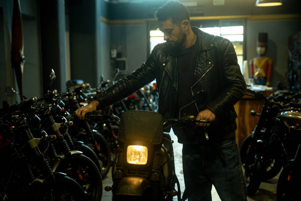 istock Portrait of man and motorcycle 1992615615