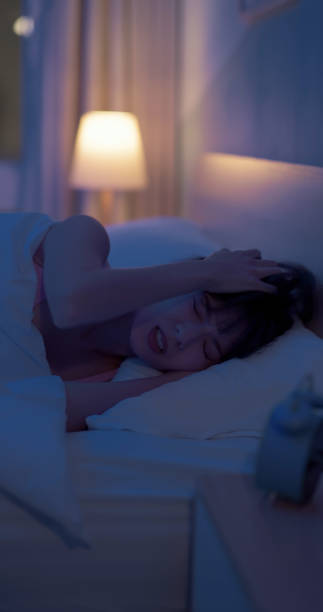 istock asian woman sleepless at night 1992621761