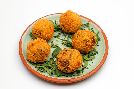 A plate of Arancino Snack culinary delicacy from the island of Sicily, in Italy.