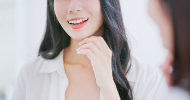 istock asian beauty satisfies her teeth 1992625654