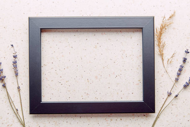 istock Aesthetic empty interior black wall frame mockup, minimalist fine art template with lavender and cane flat lay 1992627240