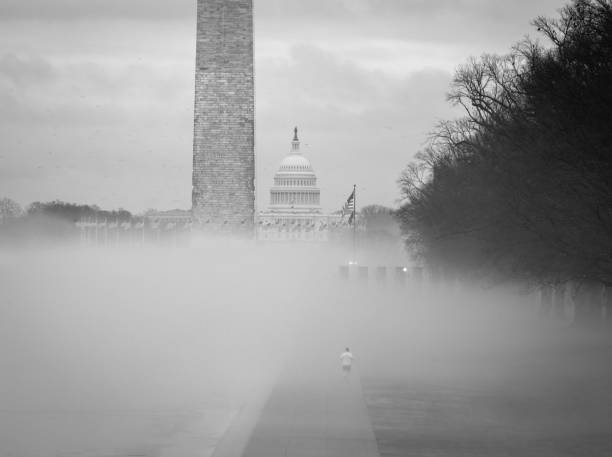 Lone runner in the mist on the National Mall, Washington DC