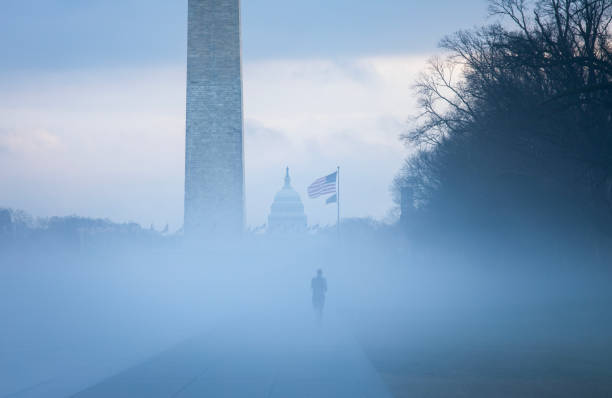 Lone runner in the mist on the National Mall, Washington DC