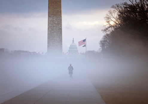 Lone runner in the mist on the National Mall, Washington DC