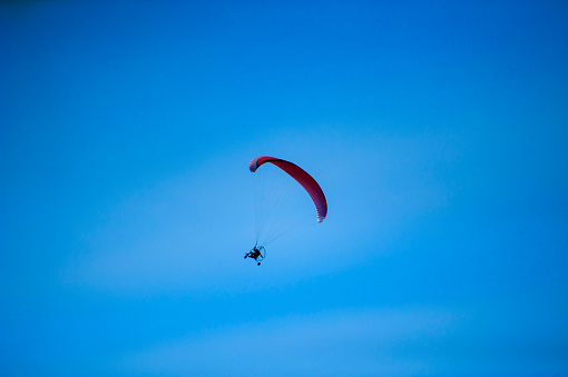 A man flying with a paramotor