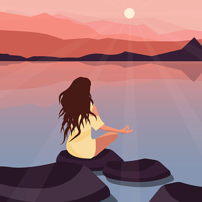 Meditation at sunset, a girl and mountains.