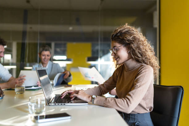 istock Young woman working on a laptop in the office 1992682324