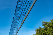 beach volleyball net against the blue sky on the beach