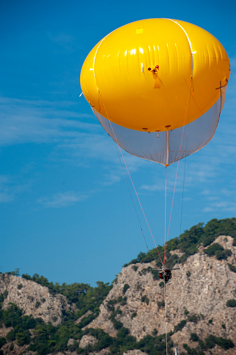 Action camera at the air balloon above yachts