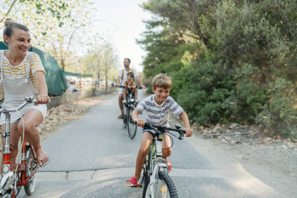 istock Young family riding bicycles in summertime 1992703056