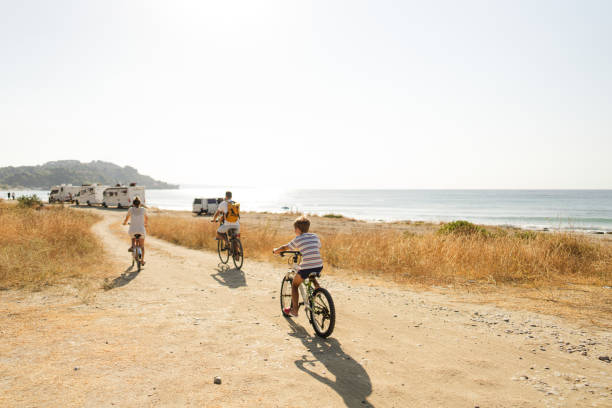 istock Young family riding bicycles in summertime 1992704111