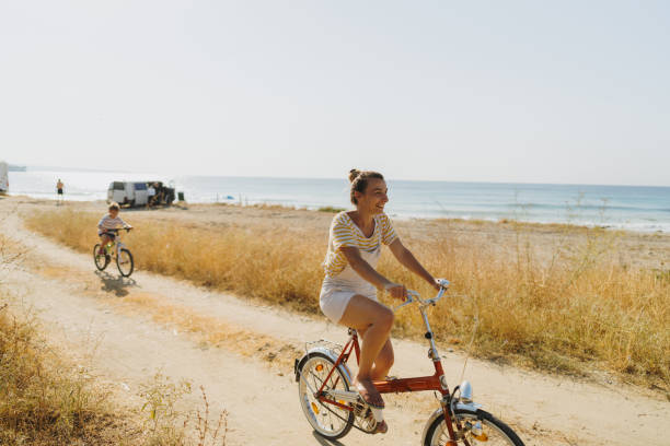 istock Mother and her little boy exploring the coastline on a bicycle 1992705672