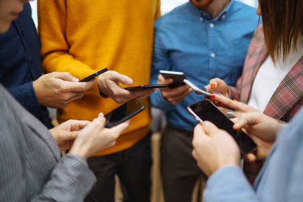 istock Group of young people using mobile phone. 1992709875