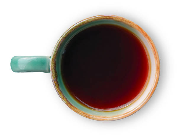 Top view of black tea in a mug.