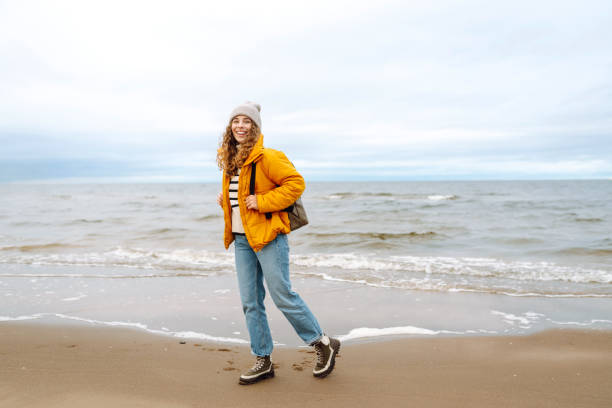 istock Happy tourist   posing by the sea. 1992716941