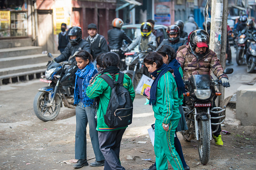 Kathmandu, Nepal- April 20,2023 : High school students dressed in school uniforms on the streets of Kathmandu.
