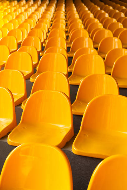 istock Plenty of yellow plastic seats at stadium. 1992728663