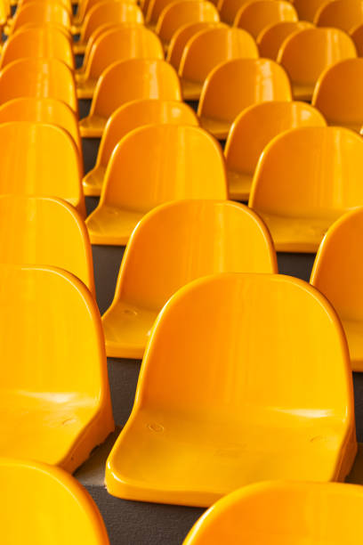 istock Plenty of yellow plastic seats at stadium. 1992728668