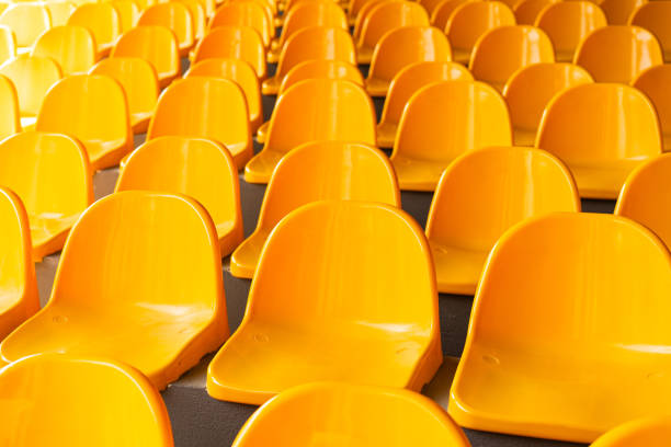 istock Plenty of yellow plastic seats at stadium. 1992729195