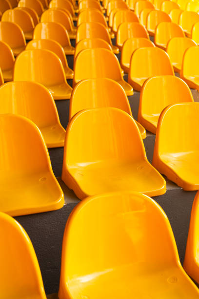 istock Plenty of yellow plastic seats at stadium. 1992729198
