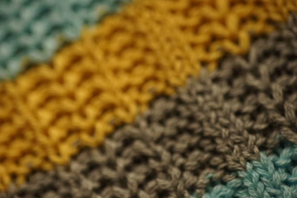 istock Striped sweater background blue, gray, brown stripes. 1992729210