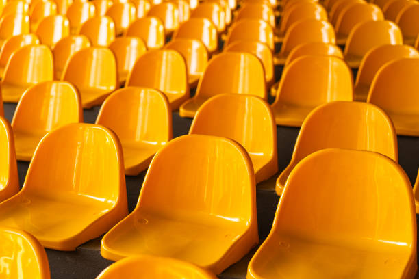 istock Plenty of yellow plastic seats at stadium. 1992729722