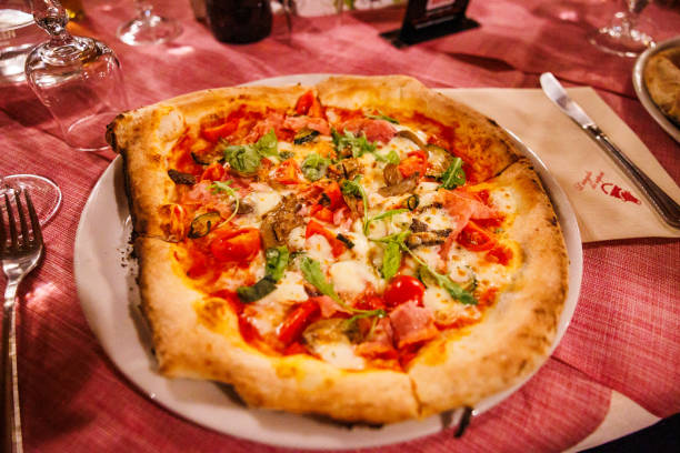 Experiencing making own pizza, demonstration about pizza, in Italy.